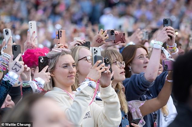 Swifties raised their phones in unison as the megastar took the stage to start the three-hour show.