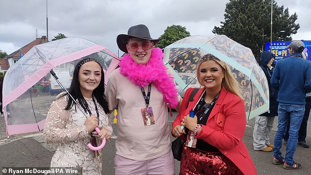 Fans brought umbrellas and waterproof jackets to protect their meticulously planned sets in Scotland from the rain.