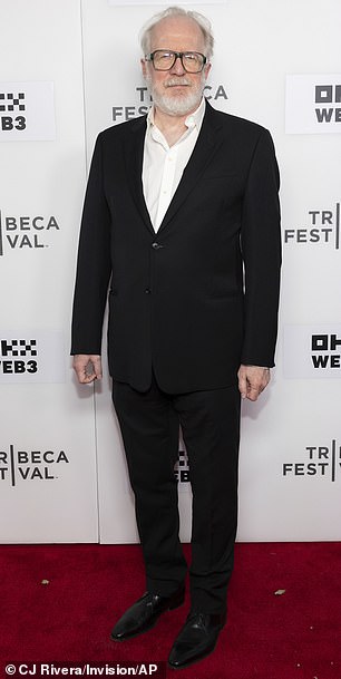 Tracy Letts, who also stars in the film, wore a black suit and a white dress shirt without a tie while walking the red carpet.