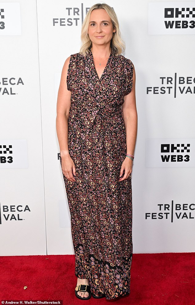 Co-writer Alex Gioulakis looked stunning in a sleeveless, ankle-length floral dress and open-toed black heels.