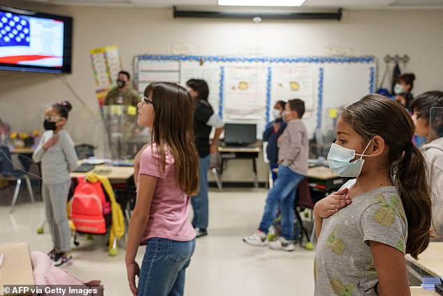 Third grade students participate in the United States National Anthem at Highland Elementary School in Las Cruces, New Mexico