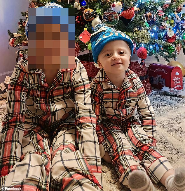 Julián (right) with his older brother at Christmas 2022 when he was two years old