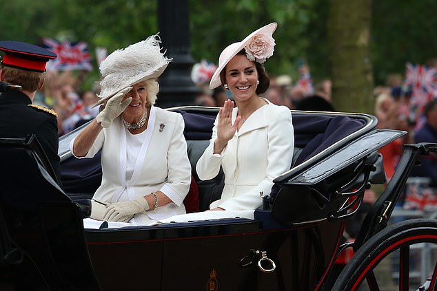 Camilla's coat was over a cream colored dress. Both royals wore similar hats with delicate floral details that completed their individual yet harmonious styles.