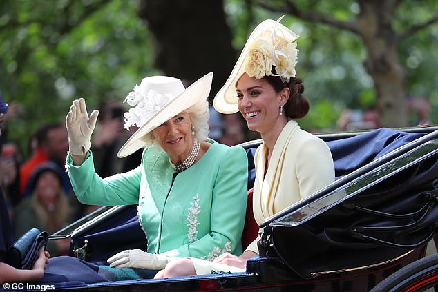 The complementary tradition continued in 2019 with Kate in a pale yellow Alexander McQueen dress and the Duchess of Cornwall in a pastel green ensemble with matching details.