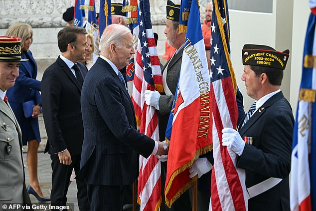 Biden met with French military veterans during the ceremony shortly after noon on Saturday.