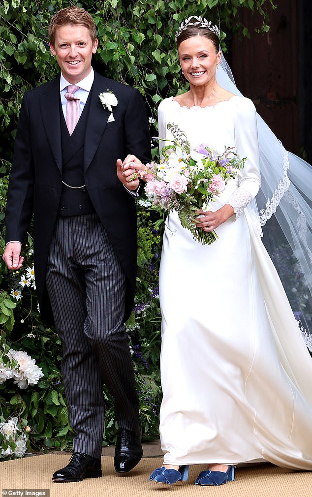 JUST MARRIED: Hugh Grosvenor and Olivia Henson, the Duke and Duchess of Westminster, are photographed beaming as they leave Chester Cathedral after their wedding ceremony.