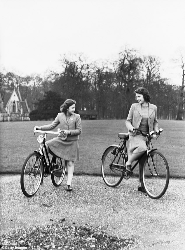 Princess Elizabeth and her sister, Princess Margaret, on bicycles in the grounds of the Royal Lodge, April 1942.