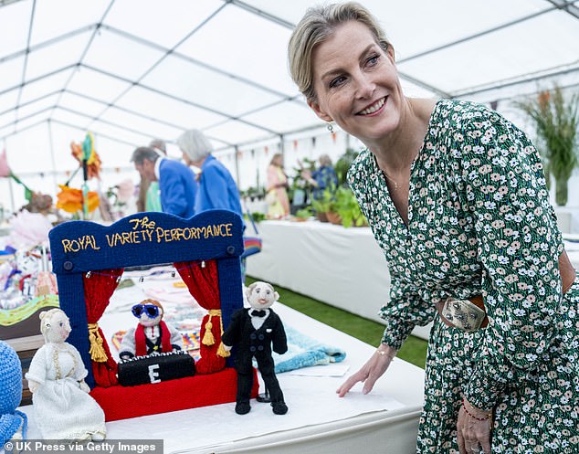 During the event, the royal was shown knitting figurines representing herself, her husband Prince Edward, and Elton John.