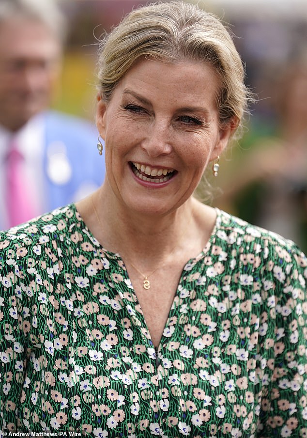 The radiant royal donned a fitting floral print dress for her appearance at the flower show today.