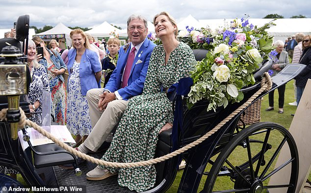 The royal was photographed sitting in a carriage alongside the event's honorary chairman, Alan Titchmarsh.