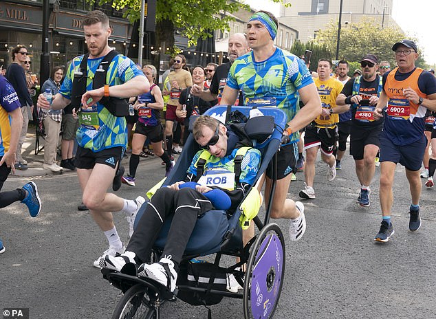 Inspiration: Kevin Sinfield pushing Rob, affected by motor neurone disease, in his wheelchair