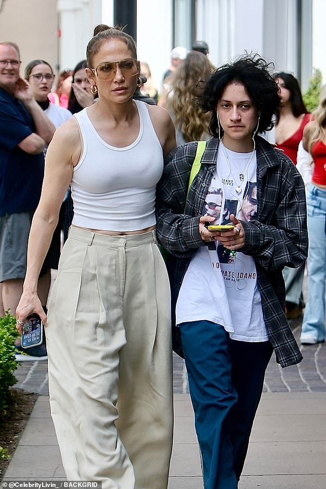 She kept her famous tresses up in a bun as she walked through the busy downtown shopping center with her teenager.