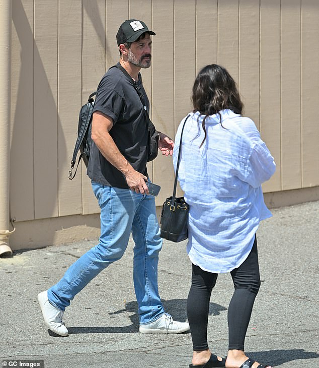 Her handsome fiancé Steve opted for a black t-shirt with cuffed sleeves and a pair of light jeans.