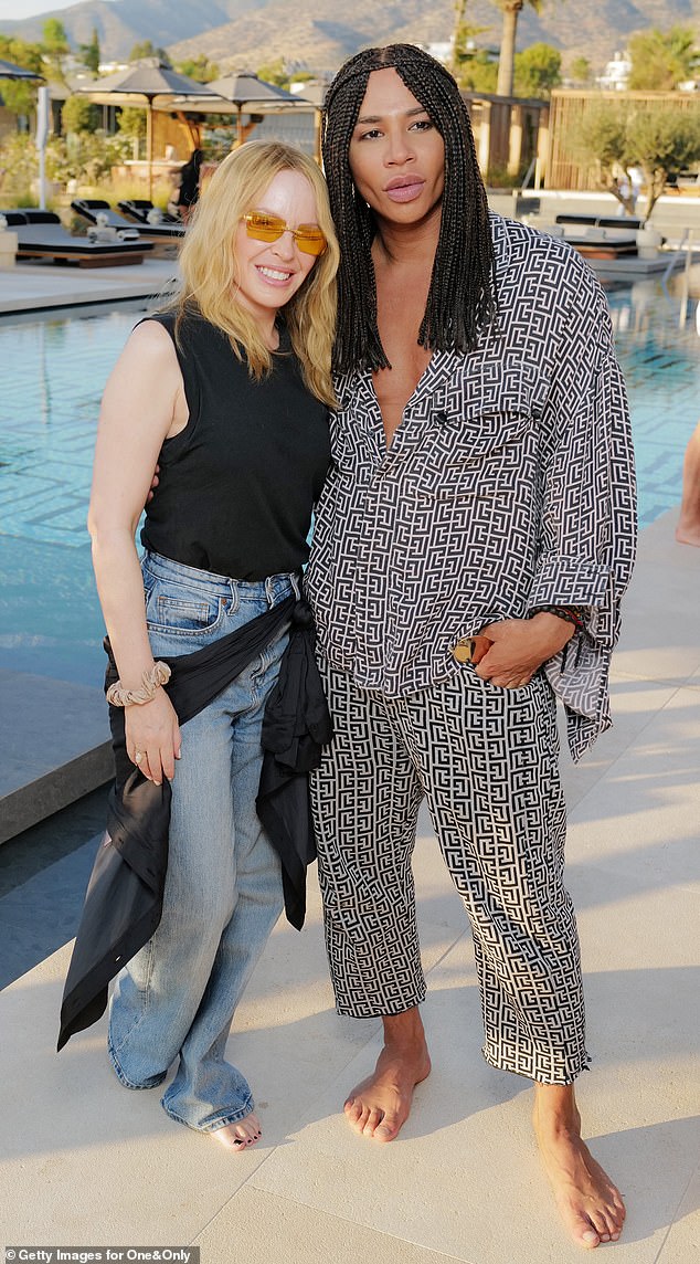 Kylie posed alongside Balmain creative director Olivier Rousteing (right) at the party.