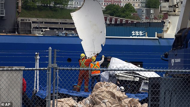 Mr Cameron said investigators had not consulted him to help with their investigations, even after he volunteered (pictured, remains of the submersible recovered after it was found at the bottom of the ocean).