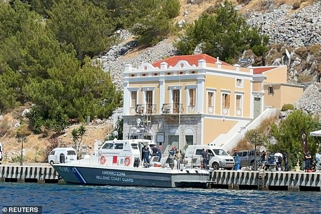 A Hellenic Coast Guard ship carrying the body is seen docked on the island of Symi.