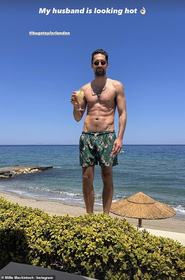 Excited for her beloved husband Hugo, she captured the hunk looking carefree on the beach with a drink in hand.