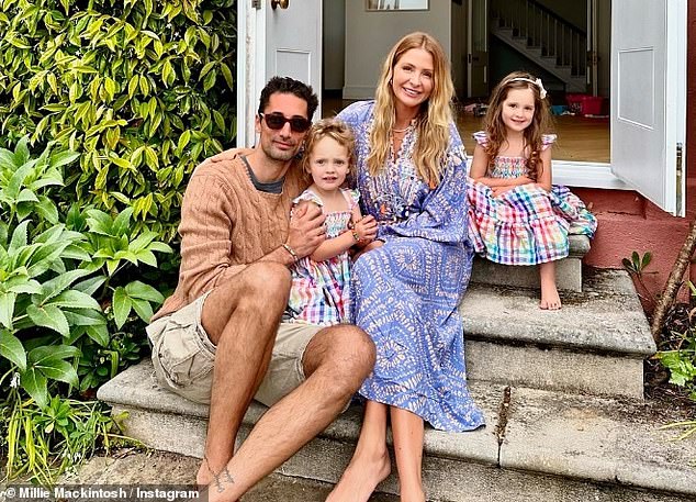 The family took a group photo for Instagram on the steps of their home over the weekend with Aurelia standing between her parents and Sienna sitting behind.