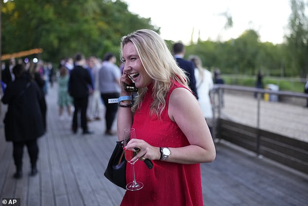 A woman was seen drinking happily as Macron called early elections