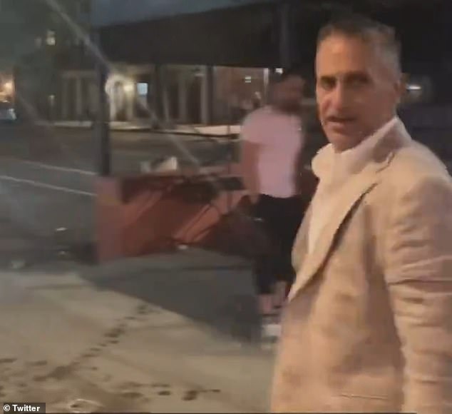 The banker, seen here turning triumphantly after the attack, works as a managing director at Moelis & Company, a leading investment bank with offices in Midtown Manhattan.