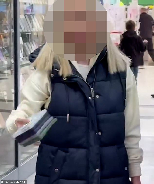 The woman pulled dozens of phone cases off shelves and threw them on the floor during the furious rampage at ElectTronex in Market Square in Uxbridge on Saturday.