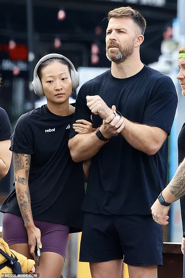 Showing off a full sleeve of tattoos, the brunette beauty kept her dark locks slicked back in a clever bun and opted to go completely makeup-free.