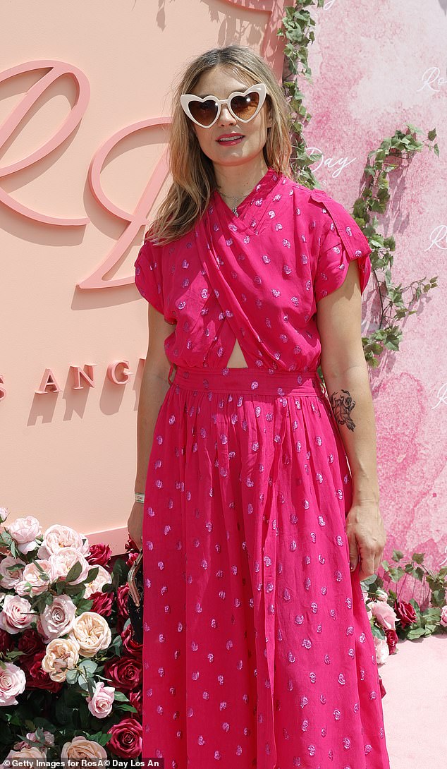 Spencer Grammer, the daughter of Kelsey Grammer, 40, arrived in a hot pink dress and white heart-shaped sunglasses.