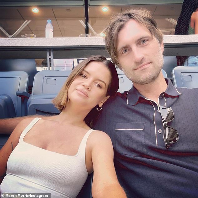 Morris' announcement came four months after finalizing her divorce from country singer Ryan Hurd (right, pictured Sept. 3), to whom she pays $2,100 in child support each month.