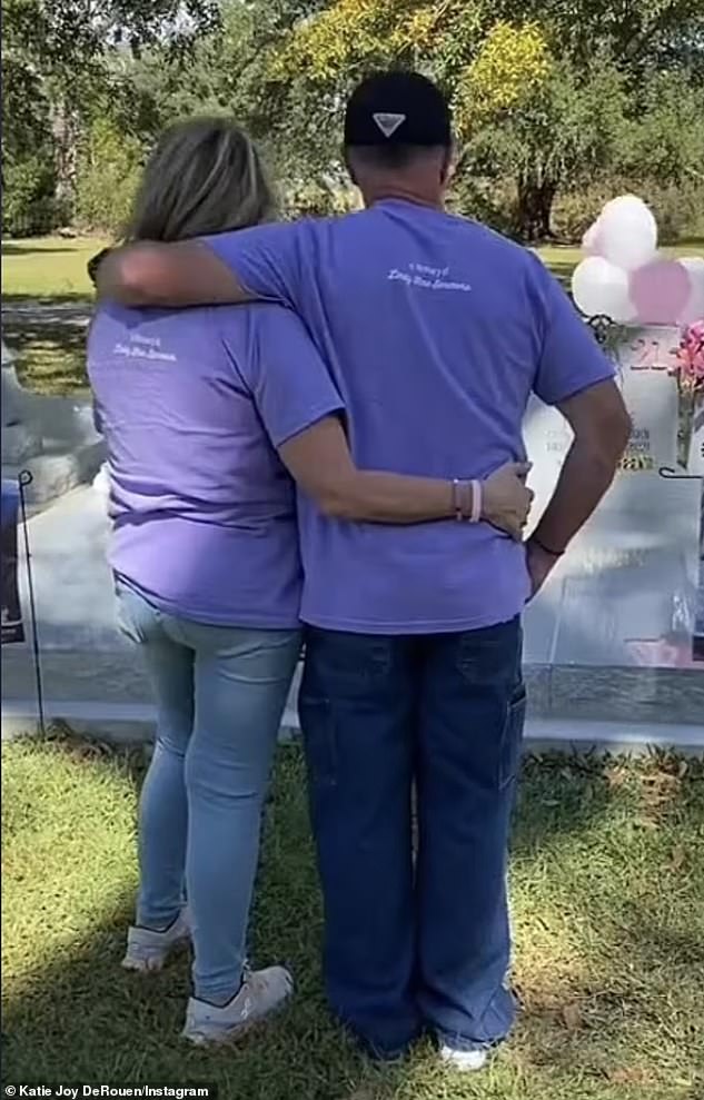 The parents share a tender moment when they are left alone with their thoughts at the graveside.