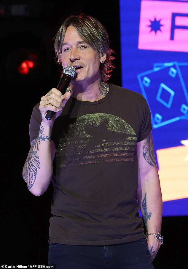 Keith, who is married to Nicole Kidman, wore a T-shirt with a faded brown graphic.