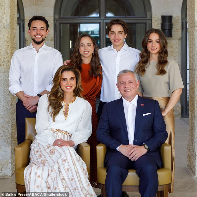 King Abdullah and Queen Rania of Jordan photographed with their children (left to right): Prince Hussein, Princess Salma, Prince Hashem and Princess Iman, December 2022.