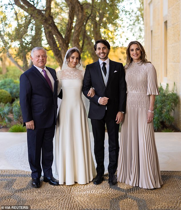 King Abdullah and Queen Rania pose for a photograph with the bride and groom, their eldest daughter Princess Iman and Jameel Alexander Thermiotis in March 2023.