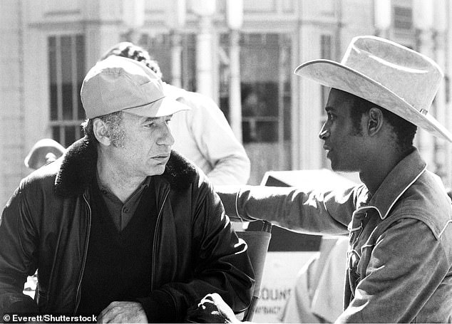 Many fans know Brooks as the director of the classic film Blazing Saddles (1974); He is working on scene with star CVleavon Little between scene takes.