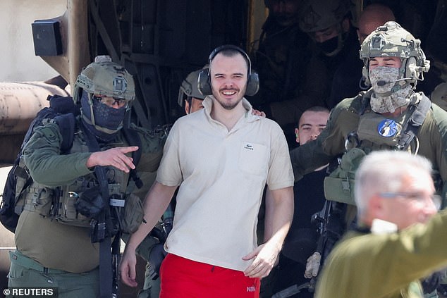 Andrey Kozlov, a freed hostage, reacts after the military said Israeli forces rescued four hostages alive from the central Gaza Strip on Saturday.