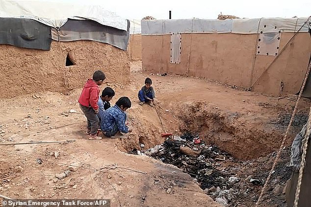 The image taken last month shows displaced Syrian children playing near a garbage dump in the Rukban camp, located in no man's land in southern Syria, bordering Iraq and Jordan. The Rukban camp was established in 2014, at the height of the war in Syria, when desperate people were fleeing jihadists from the Islamic State (IS) group and government bombing in the hope of crossing into Jordan.