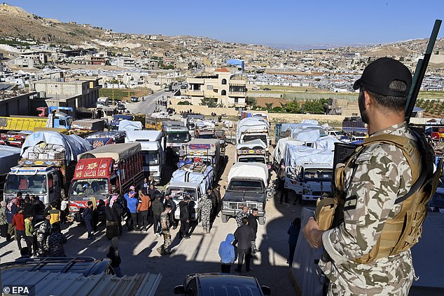 Syrian refugees gather as they prepare to leave the Arsal area, before traveling to their homes in Syria, in Arsal, Bekaa Valley, Lebanon, on May 14, 2024. Lebanese state media said on May 14 In May, some 330 Syrians in Lebanon began their 