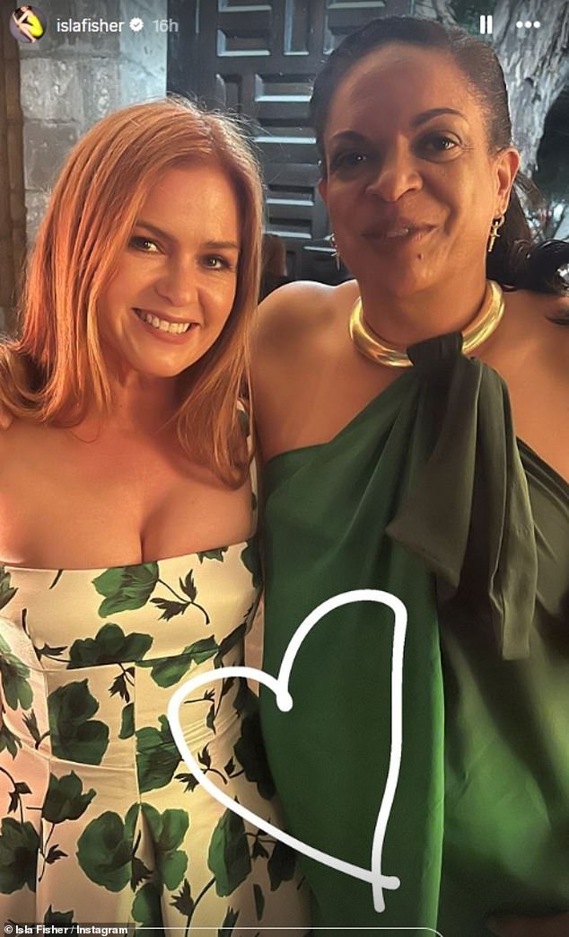 Newly single Isla Fisher was one of the celebrity guests in attendance and shared a series of snaps at the wedding (pictured with a friend).