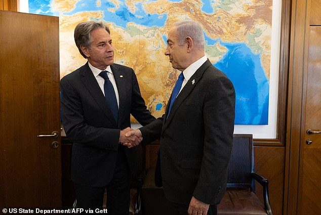 In a photo distributed Monday, Secretary of State Antony Blinken (left) is seen greeting Israeli Prime Minister Benjamin Netanyahu (right).