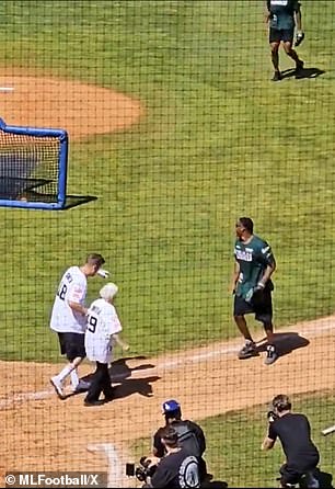 Her grandson and prankster Ross Smith, who has 4.5 million followers on YouTube, helped her as she ran to first base.