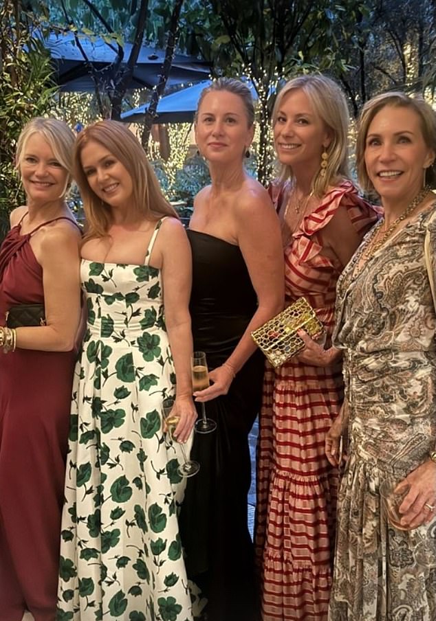 Newly single Isla Fisher (second left) was one of the celebrity guests in attendance and shared a series of snaps at the wedding (pictured with friends).