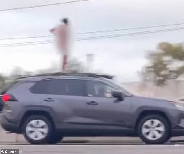 The woman raised her hands, took off her clothes and showed off the stunned motorists, with some capturing the incident on their phones.