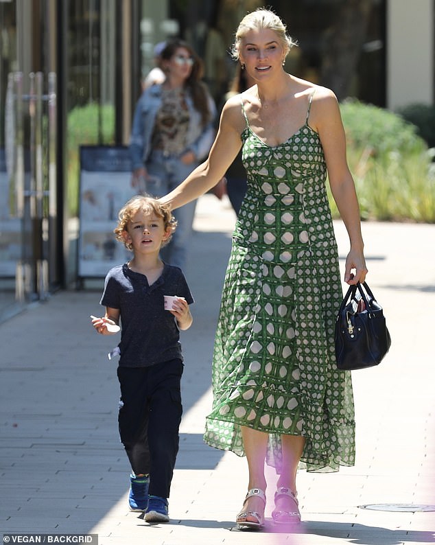 The 42-year-old talk show host wore a sleeveless green dress from Los Angeles-based Misa along with open-toed white heels for her outing with Elvis in the Encino area.