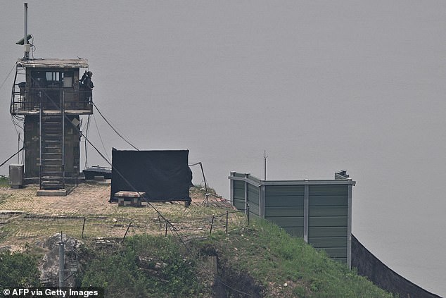 A South Korean soldier stands guard near a military facility where loudspeakers used to be dismantled in 2018, near the demilitarized zone separating the two Koreas in Paju on June 11, 2024.