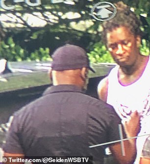 Young Thug is pictured during his arrest in the upscale Atlanta neighborhood of Buckhead.