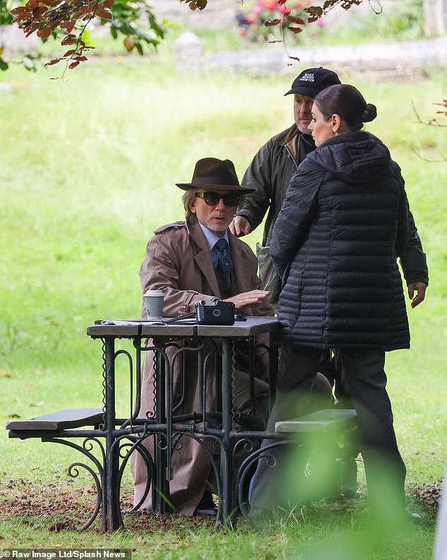 She was photographed meeting Benoit outdoors.