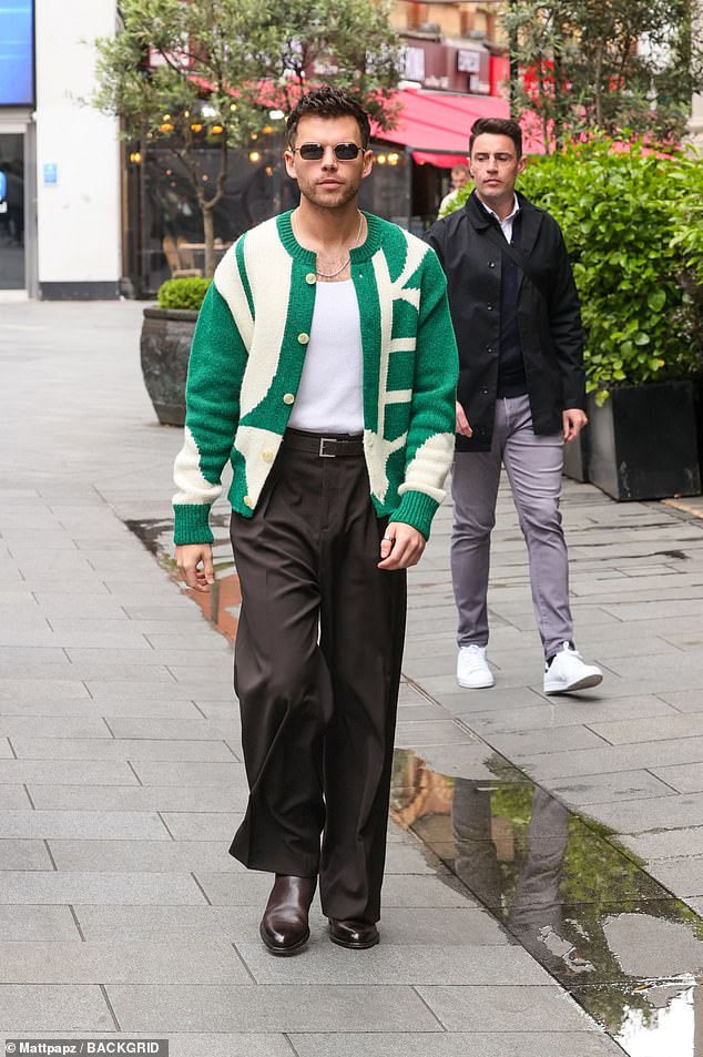 Her co-star Luke also arrived and wore a striking green and white cardigan.