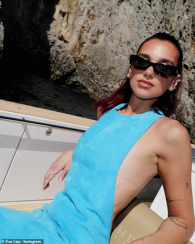 Dua Lipa, 28, looked sensational as she lounged on the boat alongside Rosie.