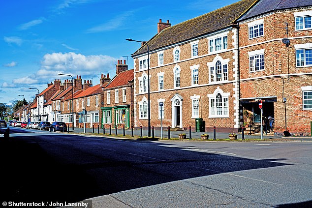 The first locomotive rolled on the Stockton and Darlington Railway in 1825. Above: Bakehouse Hill, Market Square, Darlington