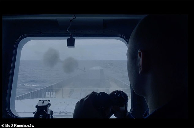 A Russian sailor looks out a window as the Russian frigate Admiral Gorshkov fires its first weapons during a naval exercise, in images released by the Russian Defense Ministry.