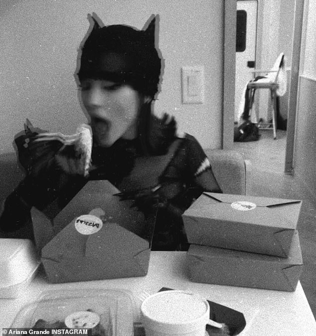 It included a clip of Boomerang opening a paper box while still sporting her Catwoman costume. An additional video, filmed in black and white, showed the beauty taking a big bite out of her lunch.